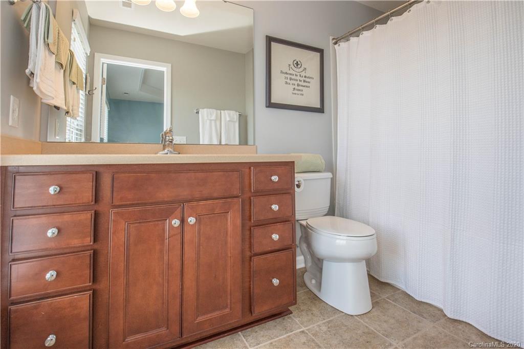 903 Lyndley Drive Fort Mill, SC 29708 - Photo 20 of 47 a bathroom with a toilet sink vanity and mirror