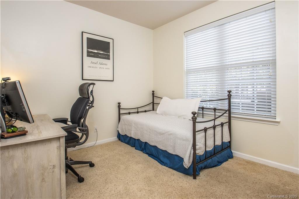 903 Lyndley Drive Fort Mill, SC 29708 - Photo 22 of 47 a bedroom with a bed chair and a window