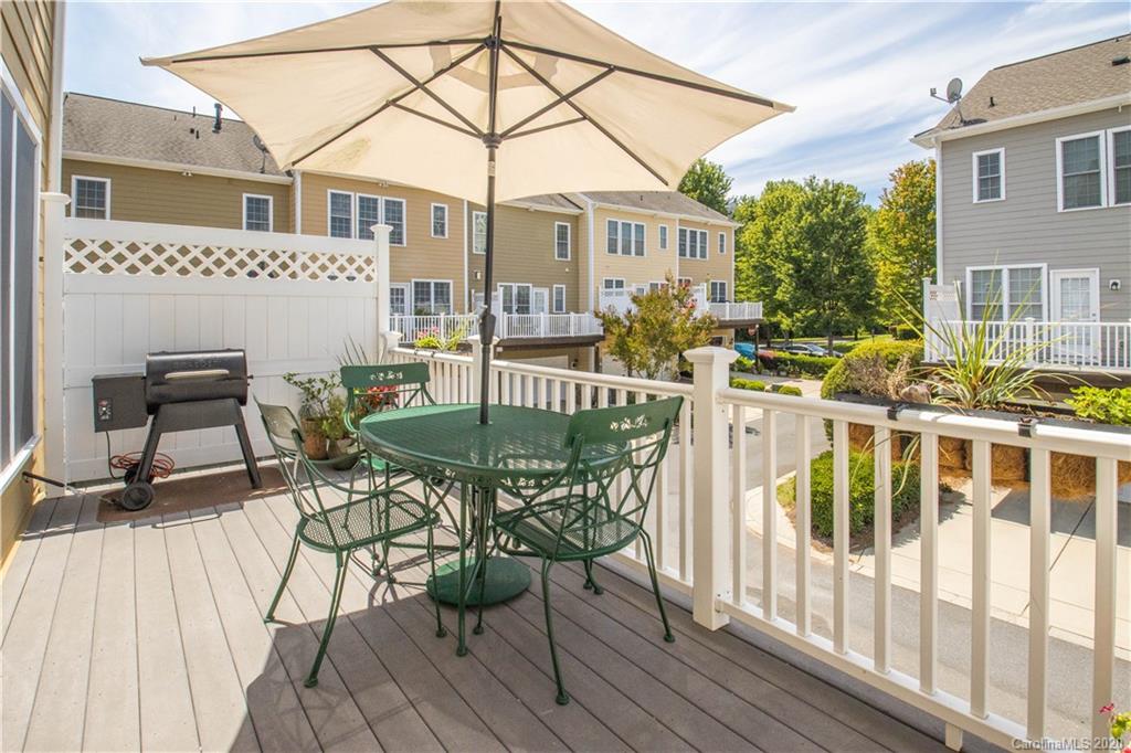 903 Lyndley Drive Fort Mill, SC 29708 - Photo 25 of 47 a view of a patio with table and chairs and wooden floor