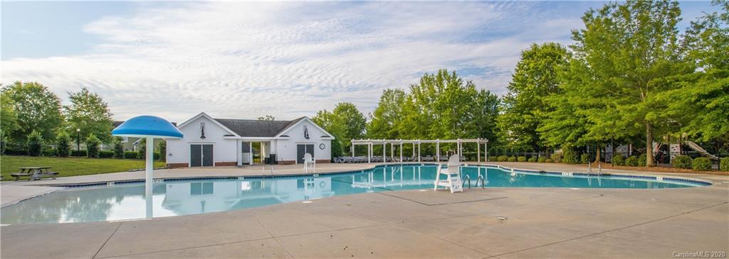 903 Lyndley Drive Fort Mill, SC 29708 - Photo 40 of 47 an outdoor view of house with swimming pool and green space