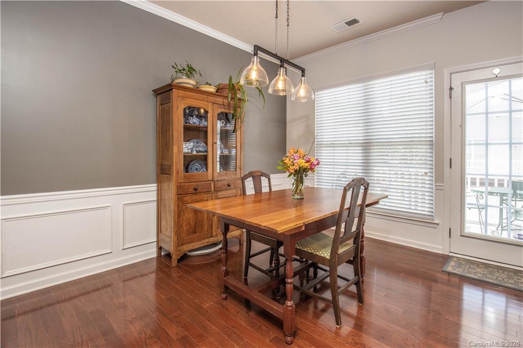 903 Lyndley Drive Fort Mill, SC 29708 - Photo 10 of 47 a view of a dining room with furniture window and wooden floor