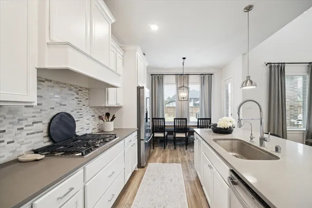a bedroom with a large bed and a large window