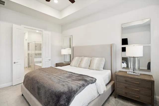 a spacious bathroom with a double vanity sink mirror double and shower