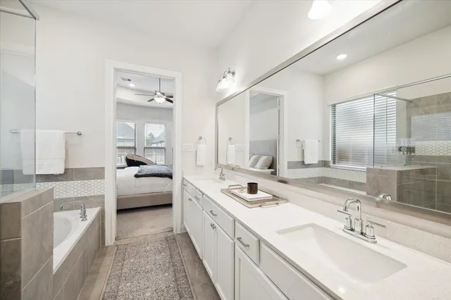 a bathroom with a bathtub and shower