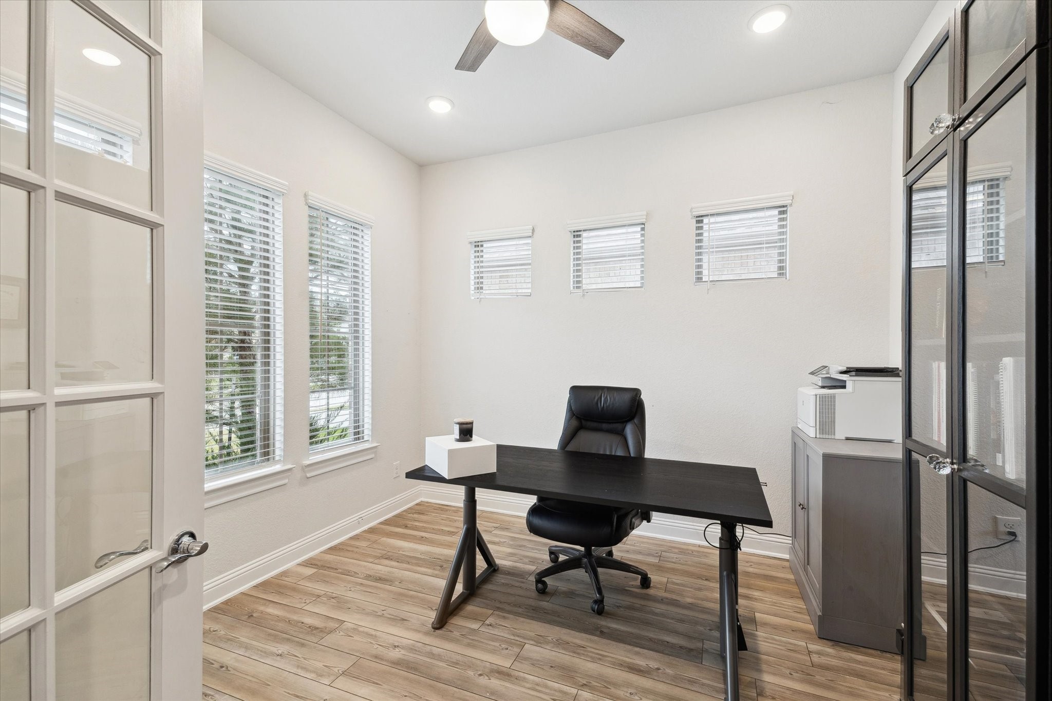 28227 Whitmore Bend Drive Spring, TX 77386 - Photo 5 of 36 The private office features French doors, abundant windows, a ceiling fan, and recessed lighting.