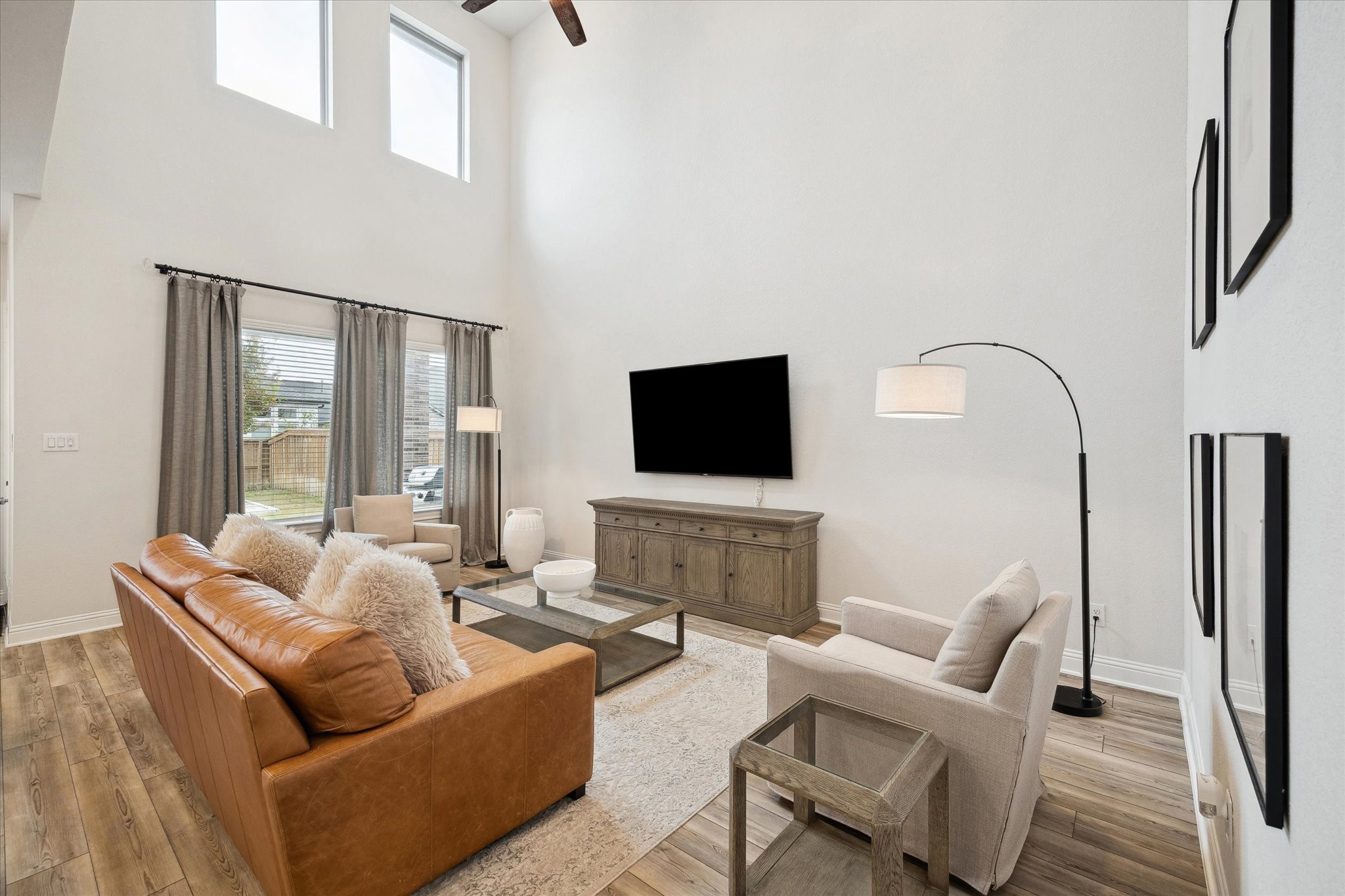 28227 Whitmore Bend Drive Spring, TX 77386 - Photo 7 of 36 With dramatic two-story ceilings, the living room offers ample space and overlooks the backyard.