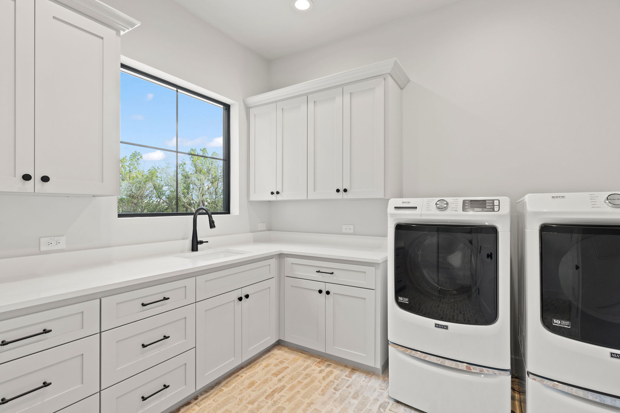 1562 Canyon Crossing View Dripping Springs, TX 78620 - Photo 13 of 40 a kitchen with a sink and cabinets