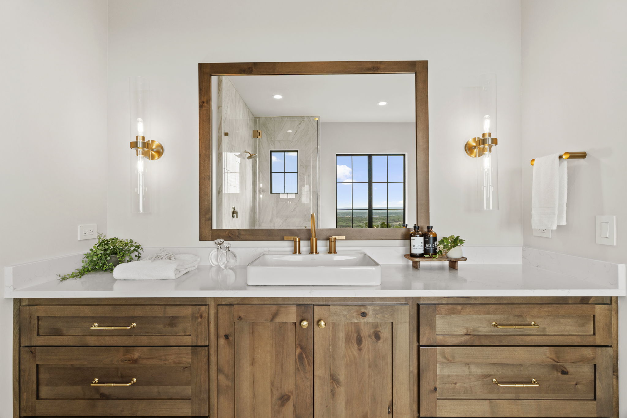 1562 Canyon Crossing View Dripping Springs, TX 78620 - Photo 18 of 40 a bathroom with a sink and a mirror