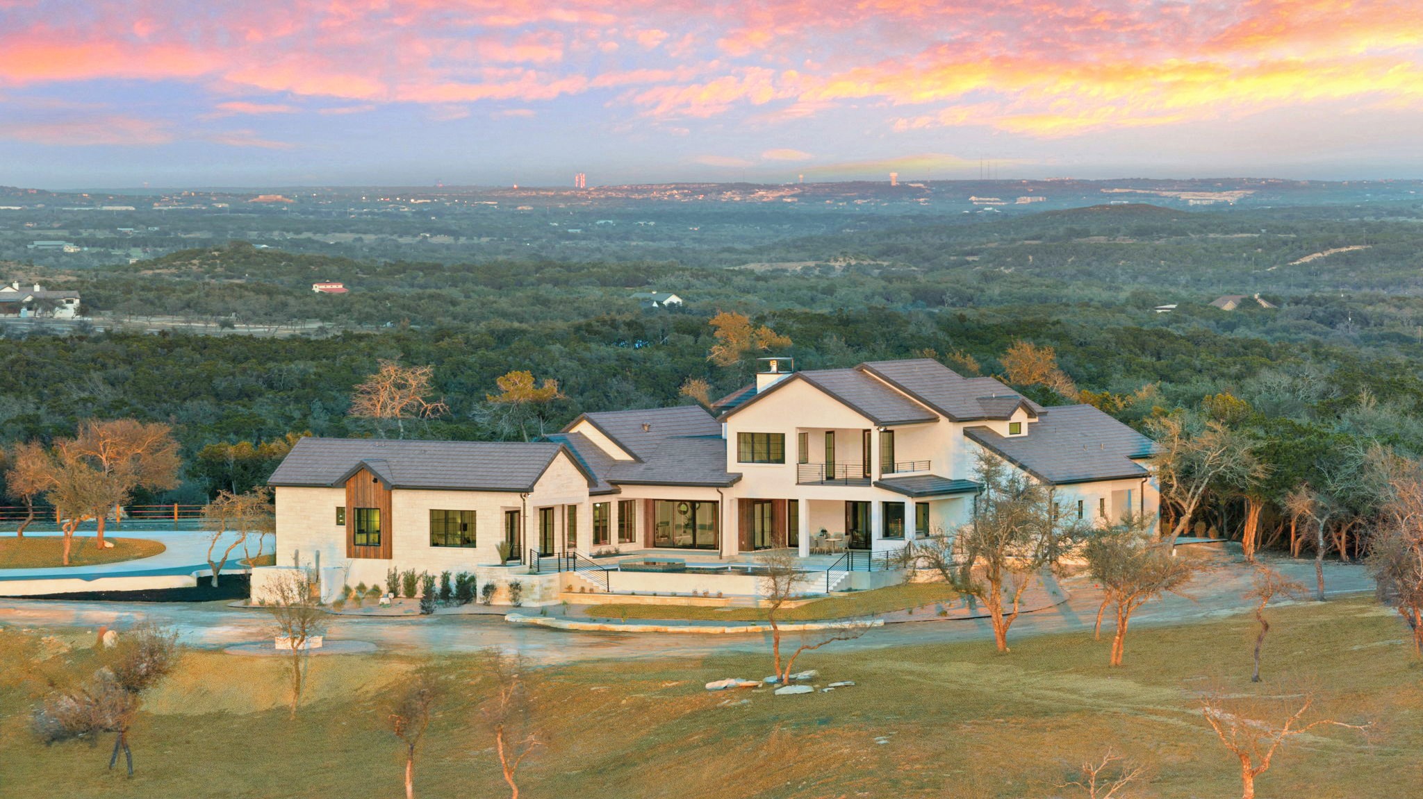 1562 Canyon Crossing View Dripping Springs, TX 78620 - Photo 2 of 40 a front view of a house with a ocean view