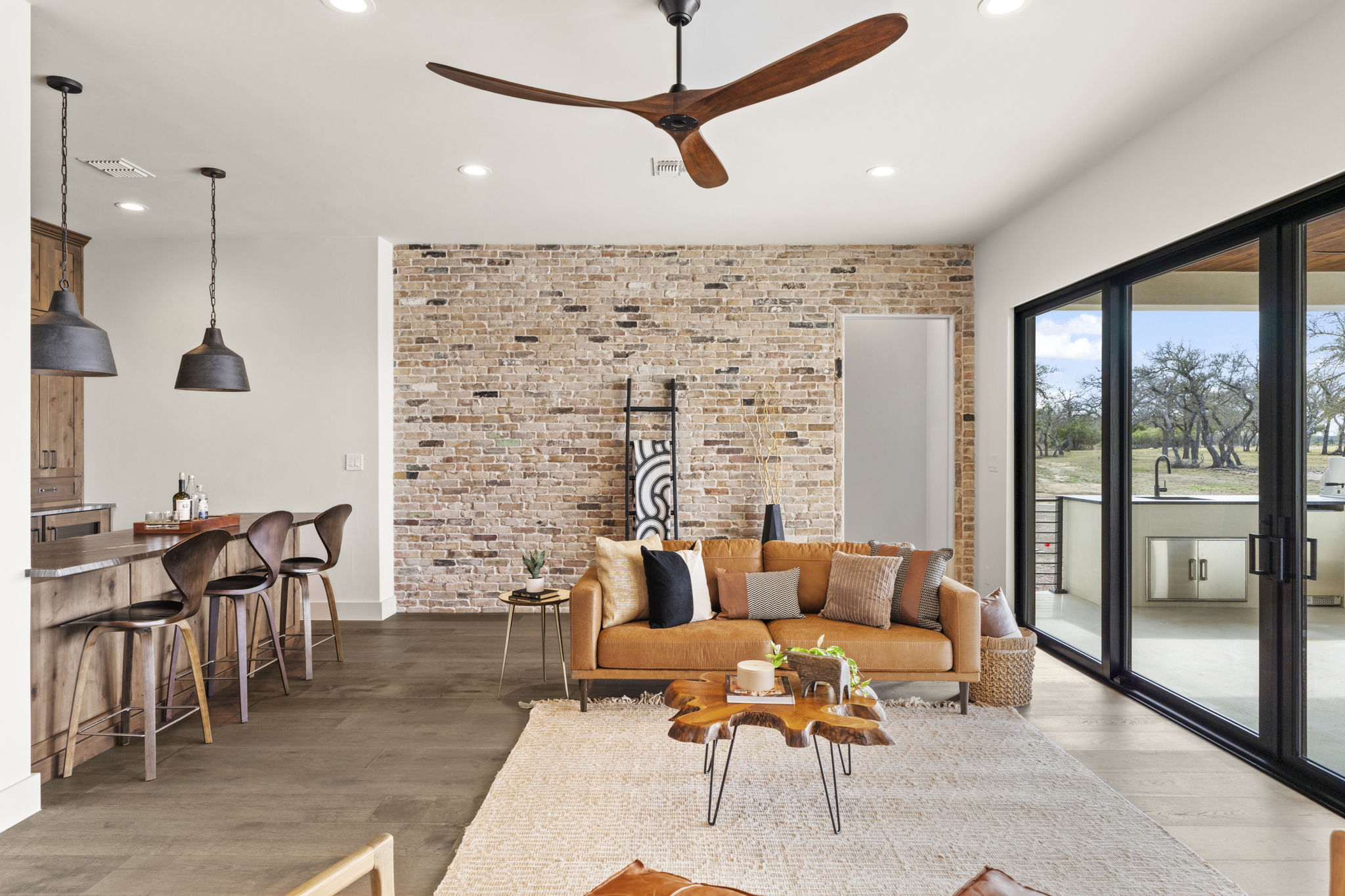 1562 Canyon Crossing View Dripping Springs, TX 78620 - Photo 23 of 40 a living room with furniture a table and chairs