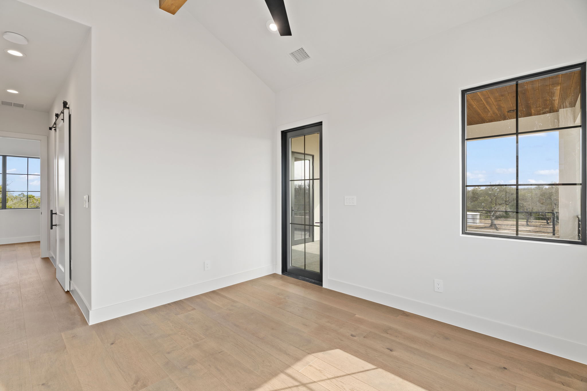 1562 Canyon Crossing View Dripping Springs, TX 78620 - Photo 33 of 40 an empty room with windows and closet