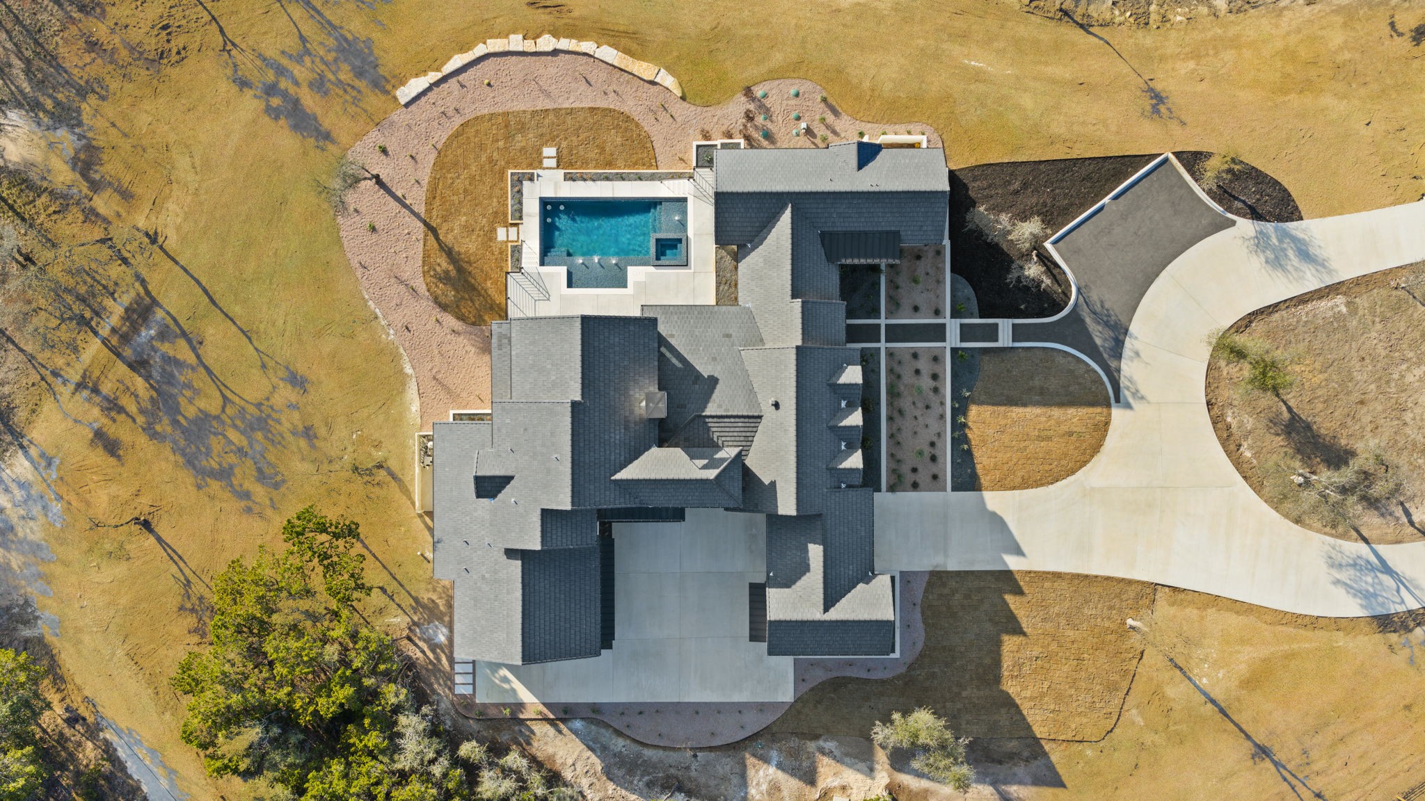 1562 Canyon Crossing View Dripping Springs, TX 78620 - Photo 39 of 40 an aerial view of a house with swimming pool