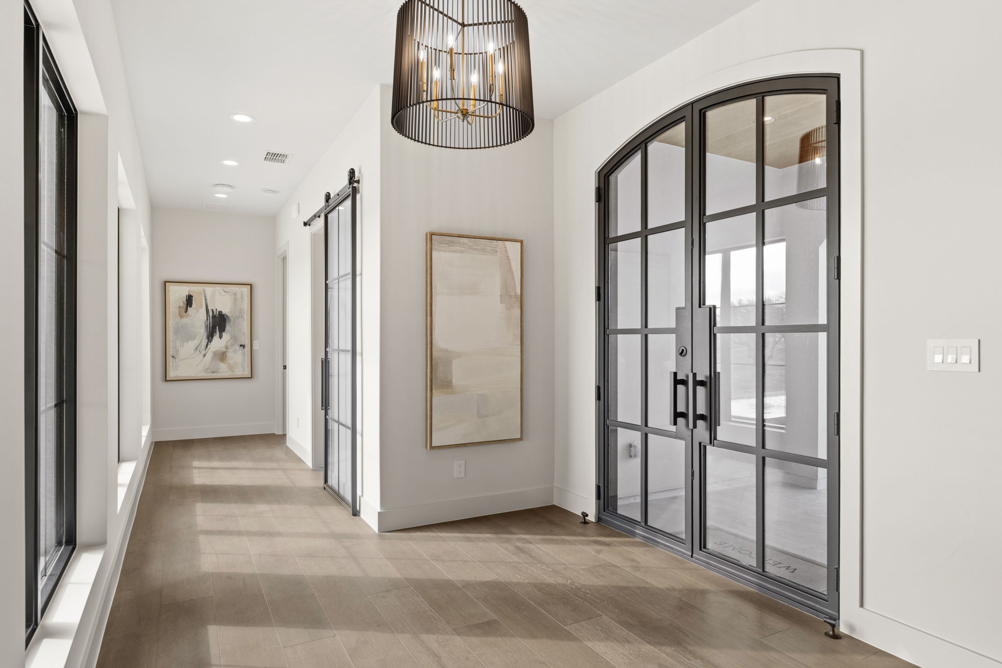 1562 Canyon Crossing View Dripping Springs, TX 78620 - Photo 6 of 40 a view of a hallway with wooden floor and entryway