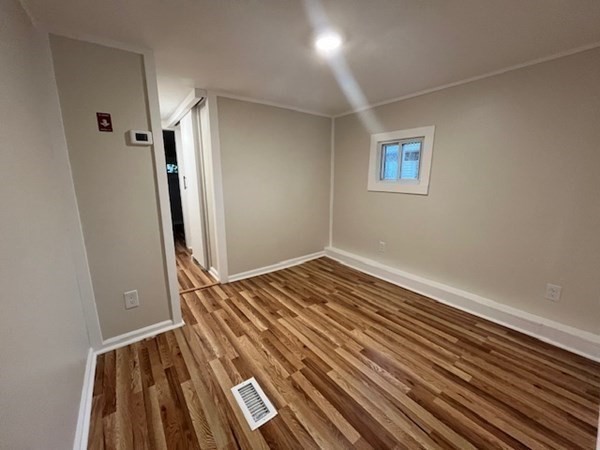 229 Miller Street, Unit C1 Ludlow, MA 01056 - Photo 6 of 19 a view of a room with wooden floor and staircase