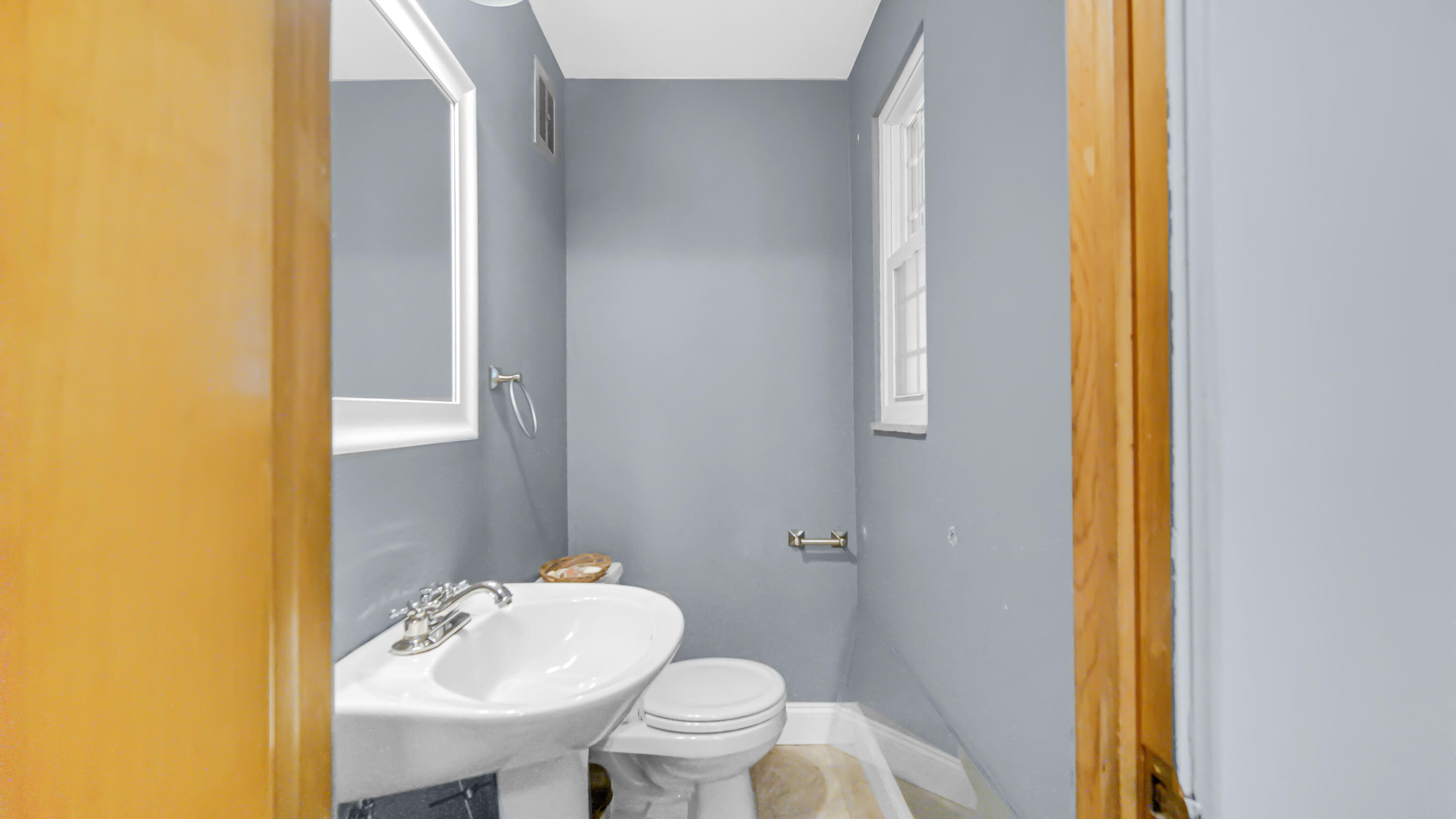 6957 Ash Avenue Gary, IN 46403 - Photo 13 of 22 a bathroom with a sink mirror and toilet
