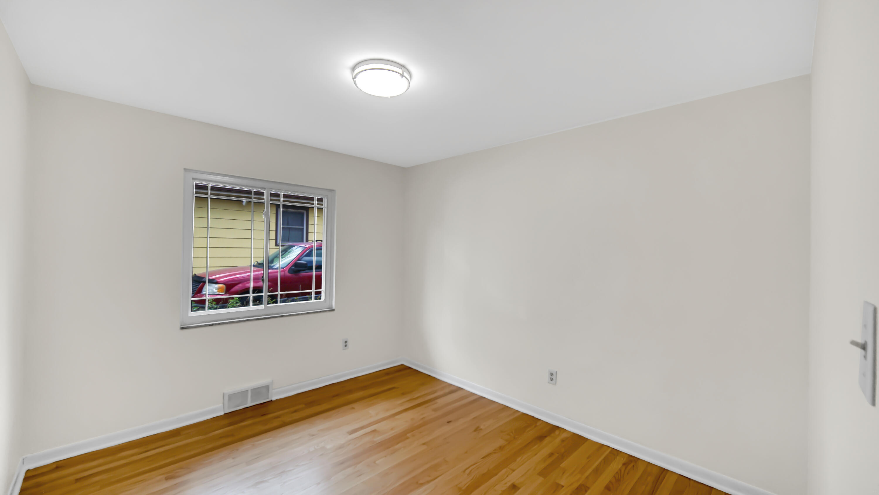6957 Ash Avenue Gary, IN 46403 - Photo 14 of 22 a view of empty room with wooden floor