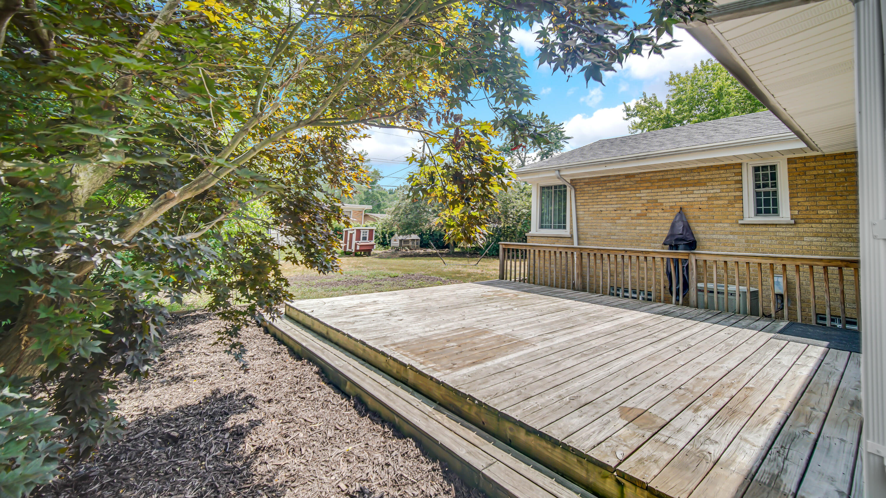 6957 Ash Avenue Gary, IN 46403 - Photo 22 of 22 a view of a backyard with wooden floor and fence