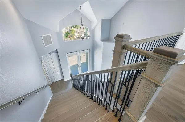 a living room with furniture and a mirror