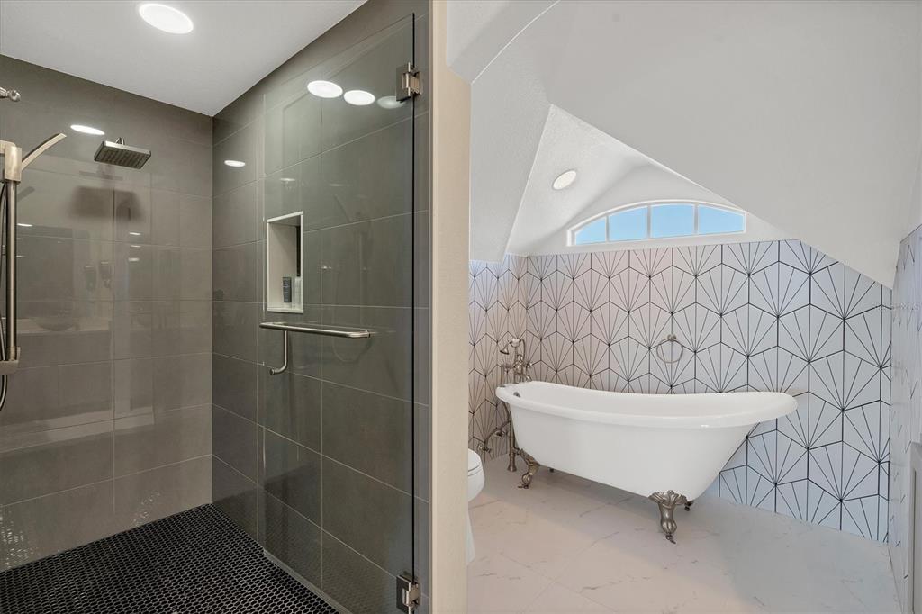 1910 Oregon Trail Englewood, FL 34224 - Photo 40 of 65 a bathroom with a sink a toilet and shower