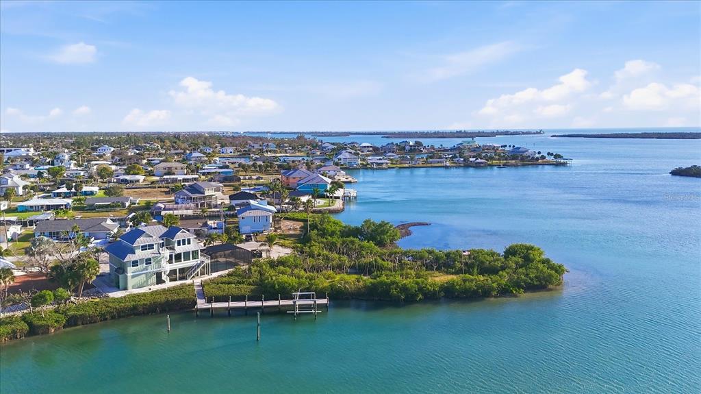 1910 Oregon Trail Englewood, FL 34224 - Photo 4 of 65 an aerial view of a houses with a lake view