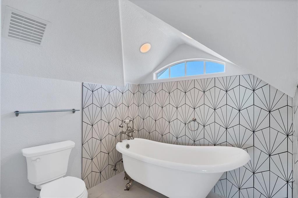 1910 Oregon Trail Englewood, FL 34224 - Photo 41 of 65 a bathroom with a toilet and a tub