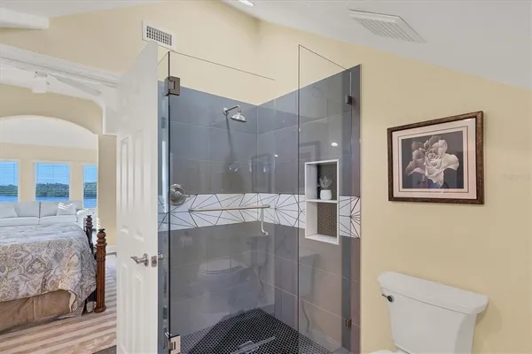 an aerial view of a house with a lake view