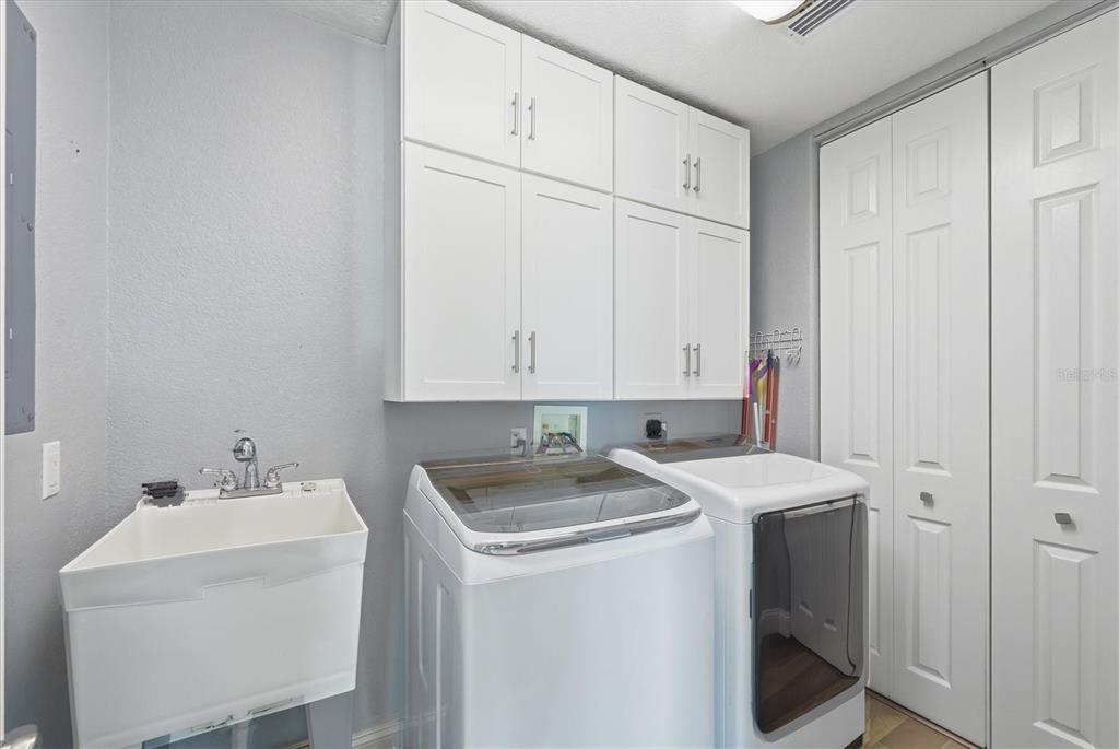 1910 Oregon Trail Englewood, FL 34224 - Photo 47 of 65 a utility room with dryer and washer