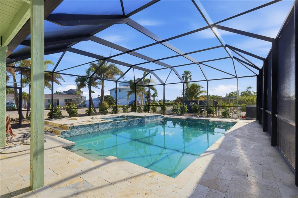1910 Oregon Trail Englewood, FL 34224 - Photo 48 of 65 a view of a swimming pool with a patio
