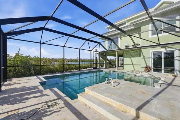 a view of a park with a slide and potted plants