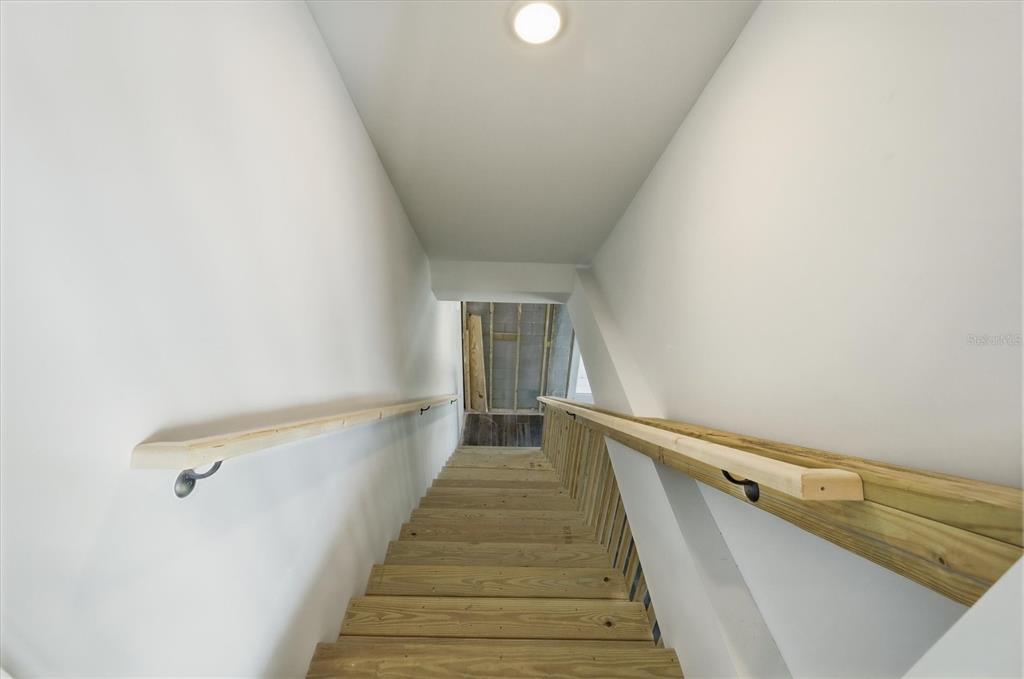 1910 Oregon Trail Englewood, FL 34224 - Photo 52 of 65 a view of a hallway with staircase