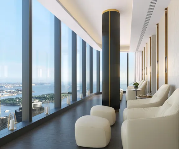 a living room with furniture and floor to ceiling window