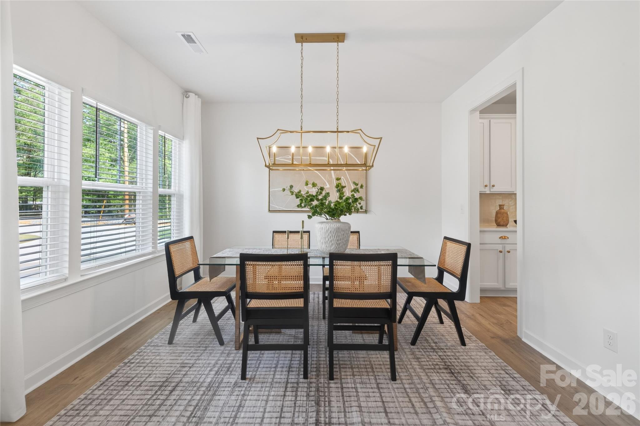 128 Overcash Road, Unit 7171 Troutman, NC 28166 - Photo 10 of 41 a view of a dining room with furniture window and outside view