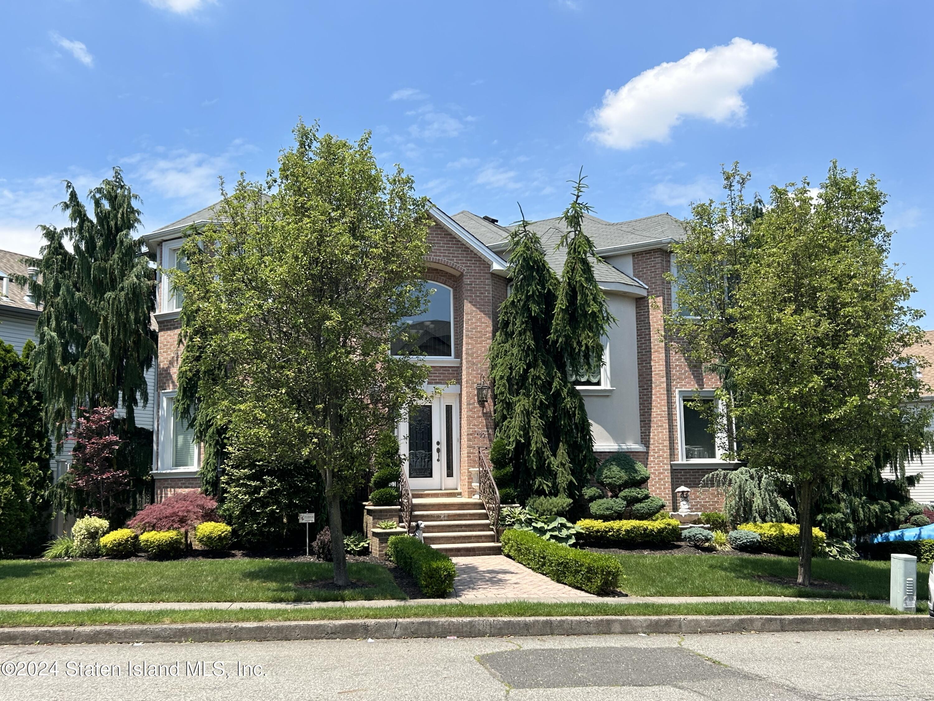 front view of a house with a yard