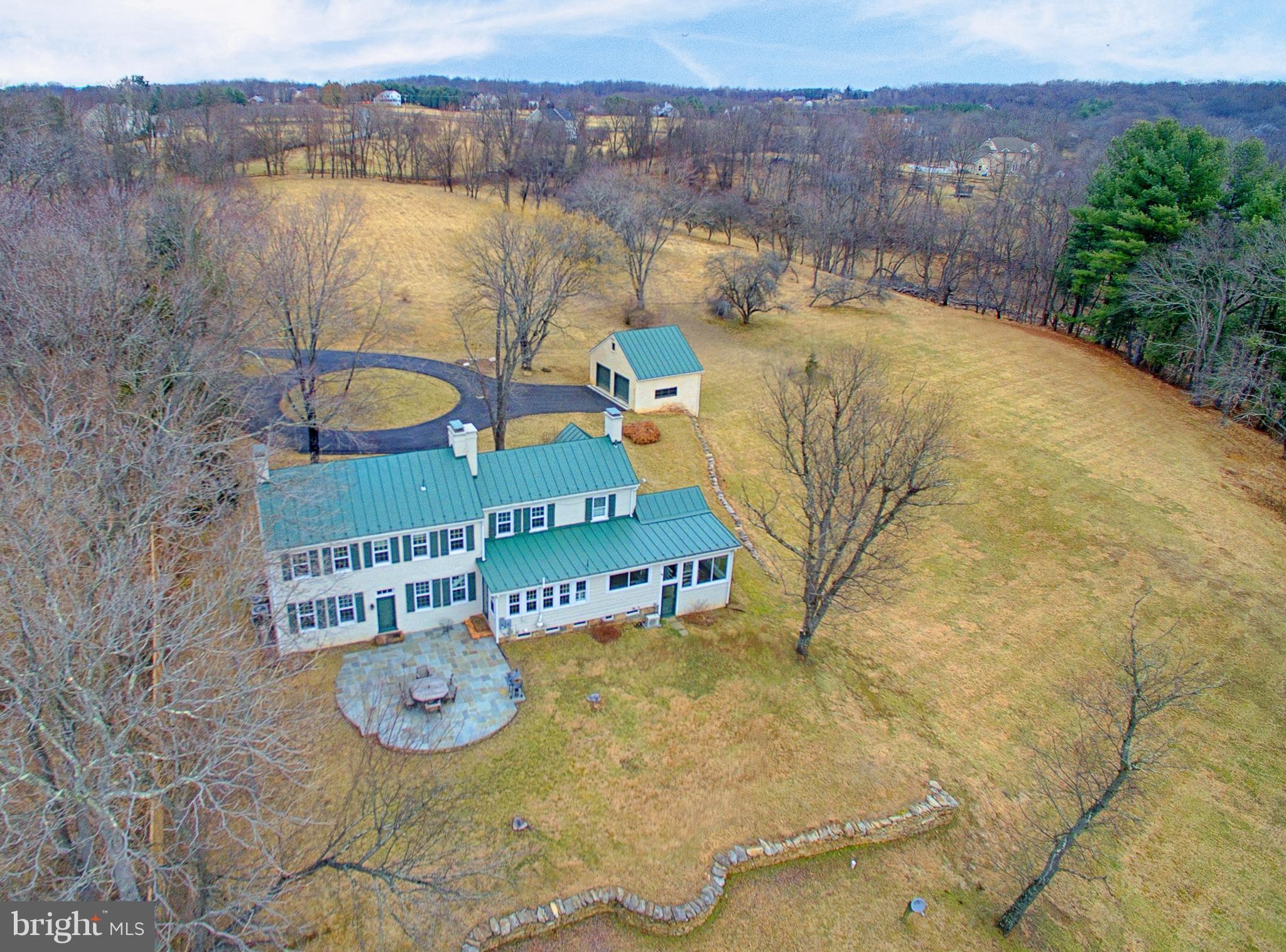 20046 St Louis Road Purcellville, VA 20132 - Photo 1 of 30 an aerial view of a house with outdoor space and lake view