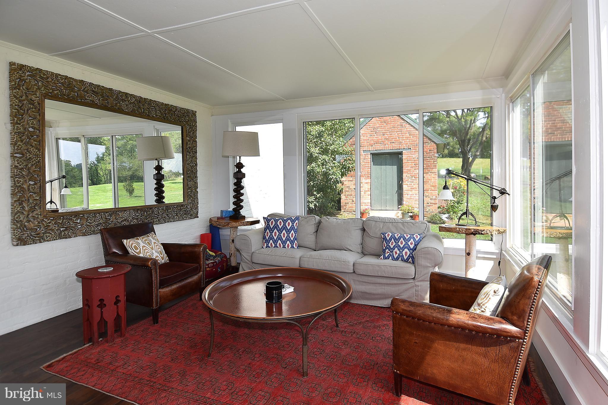 20046 St Louis Road Purcellville, VA 20132 - Photo 12 of 30 a living room with furniture and a large window