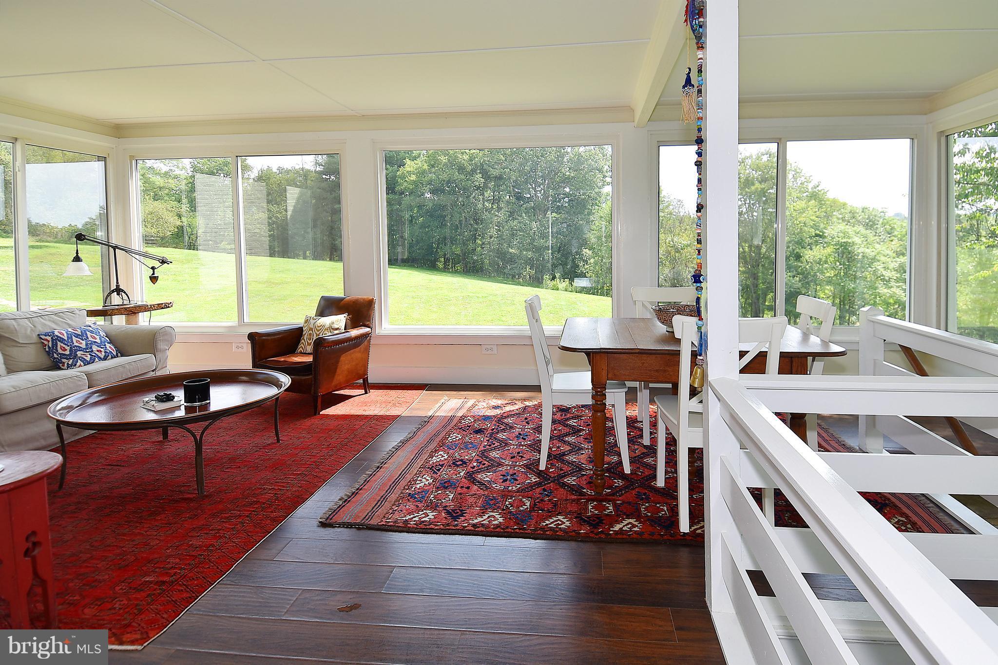 20046 St Louis Road Purcellville, VA 20132 - Photo 13 of 30 a living room with furniture and large windows