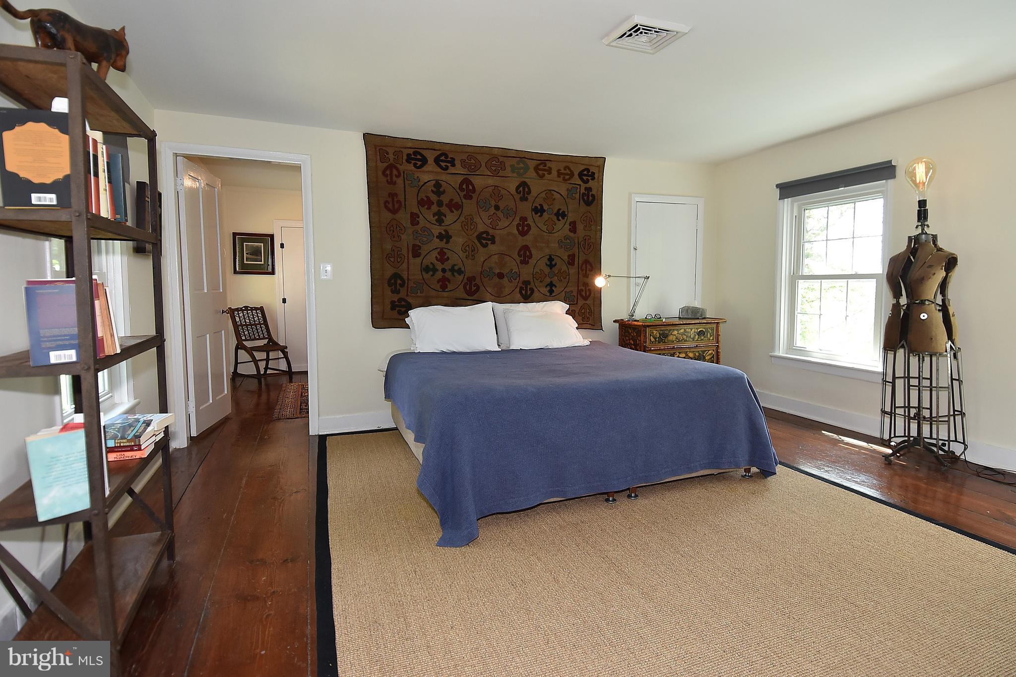 20046 St Louis Road Purcellville, VA 20132 - Photo 16 of 30 a bedroom with a bed window and dresser