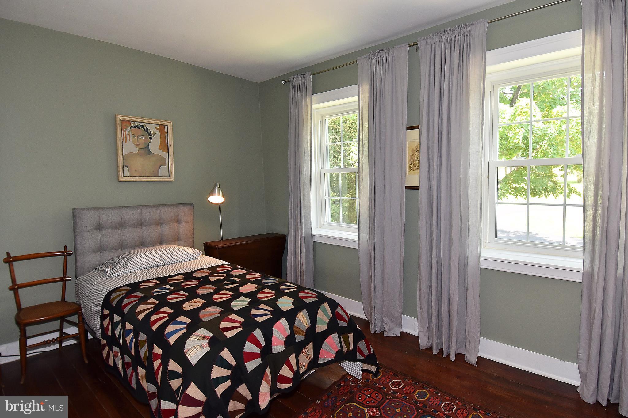 20046 St Louis Road Purcellville, VA 20132 - Photo 23 of 30 a bedroom with a bed and a window