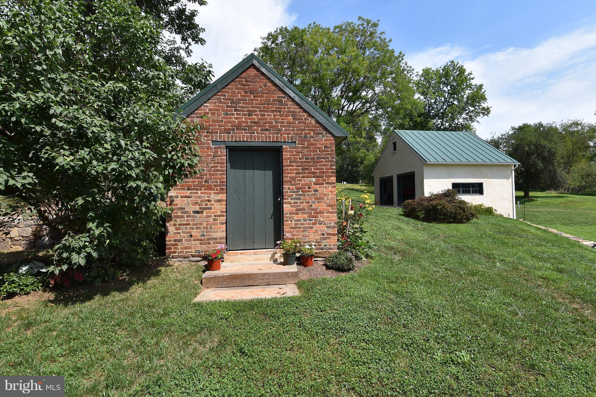 20046 St Louis Road Purcellville, VA 20132 - Photo 25 of 30 a front view of a house with a yard and garage