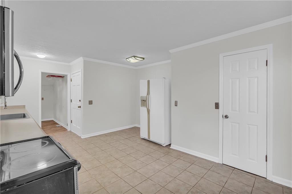 32 Cox Road Southeast Cartersville, GA 30121 - Photo 13 of 60 a view of a kitchen with white cabinets