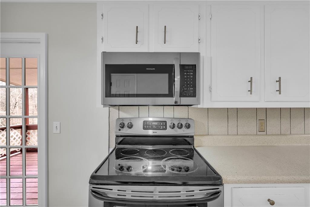 32 Cox Road Southeast Cartersville, GA 30121 - Photo 14 of 60 a stove top oven sitting inside of a kitchen