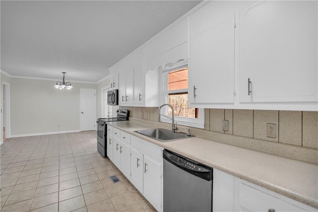32 Cox Road Southeast Cartersville, GA 30121 - Photo 16 of 60 a kitchen with a sink cabinets and window