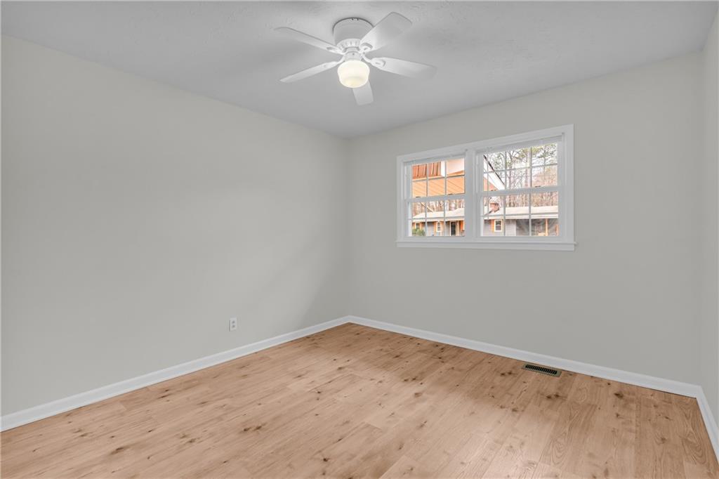 32 Cox Road Southeast Cartersville, GA 30121 - Photo 23 of 60 wooden floor in an empty room with a window