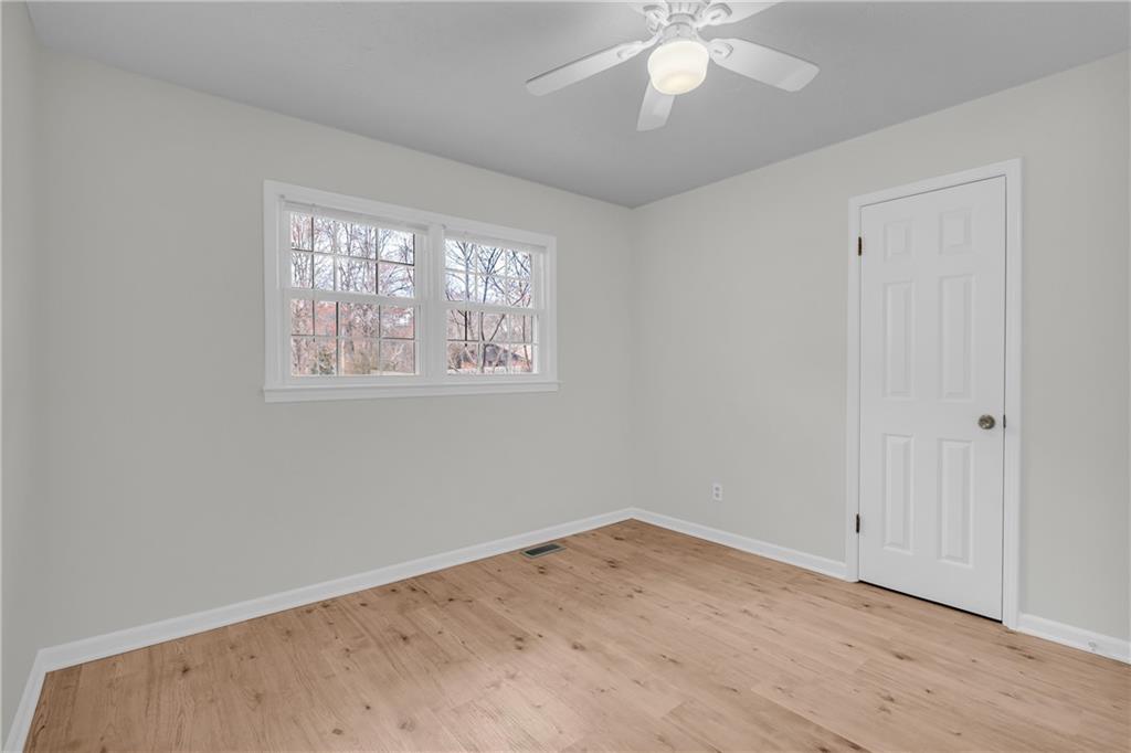 32 Cox Road Southeast Cartersville, GA 30121 - Photo 24 of 60 a view of empty room with wooden floor and fan
