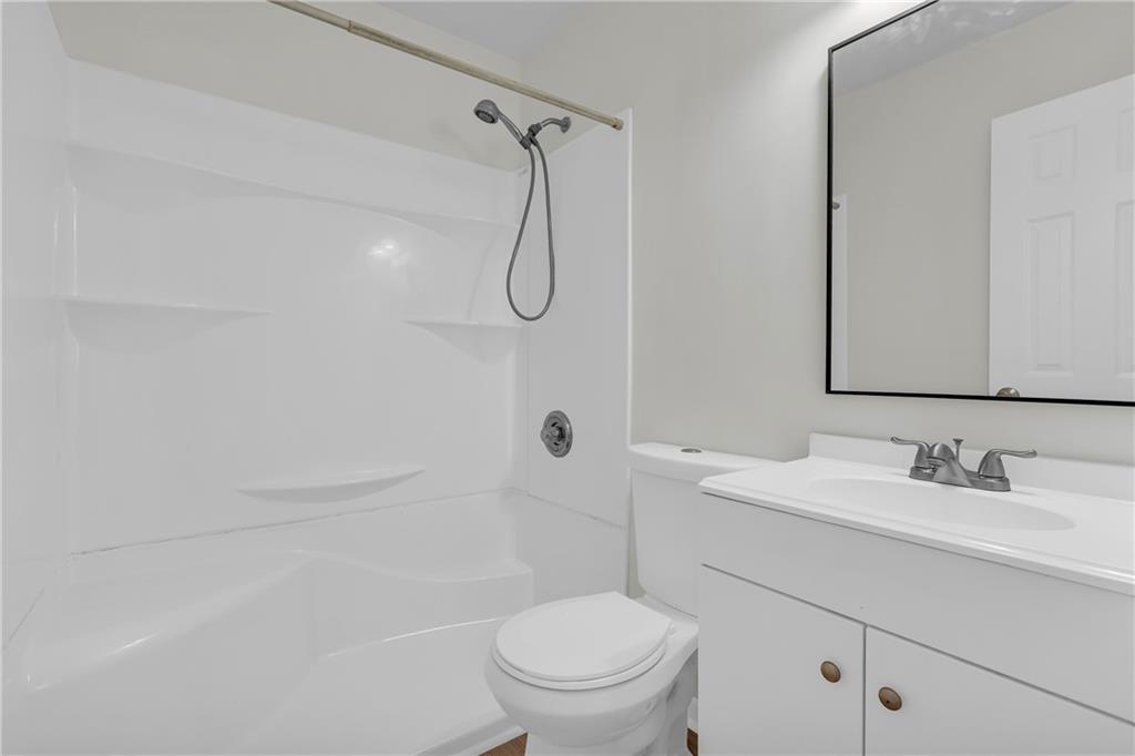 32 Cox Road Southeast Cartersville, GA 30121 - Photo 26 of 60 a bathroom with a sink a toilet and shower