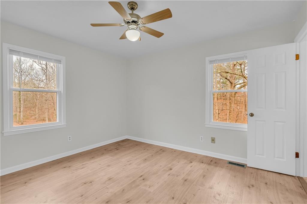 32 Cox Road Southeast Cartersville, GA 30121 - Photo 27 of 60 an empty room with a window and a fan