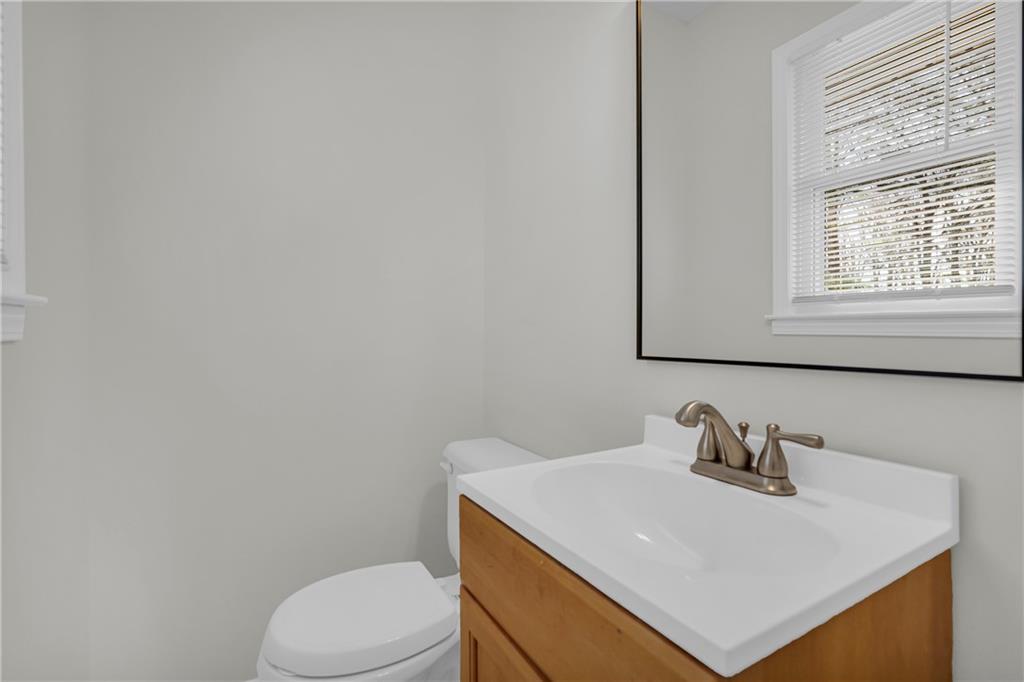 32 Cox Road Southeast Cartersville, GA 30121 - Photo 30 of 60 a white toilet sitting next to a bathroom sink