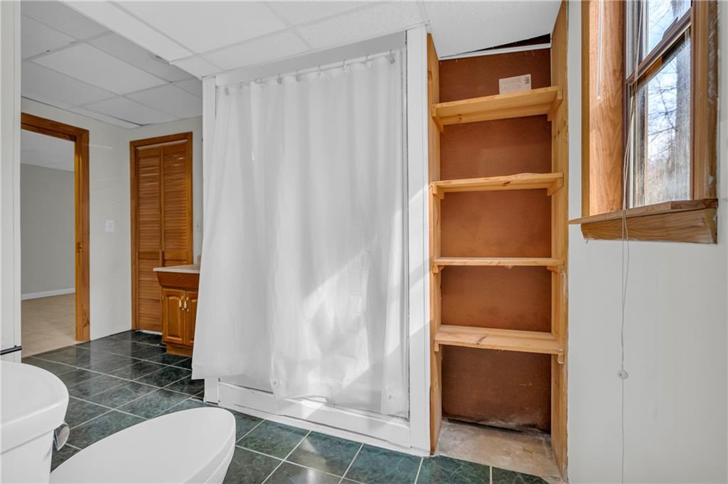 32 Cox Road Southeast Cartersville, GA 30121 - Photo 40 of 60 a bathroom with a toilet and a shower