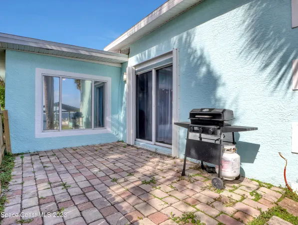 a room that has a bed and a table in it