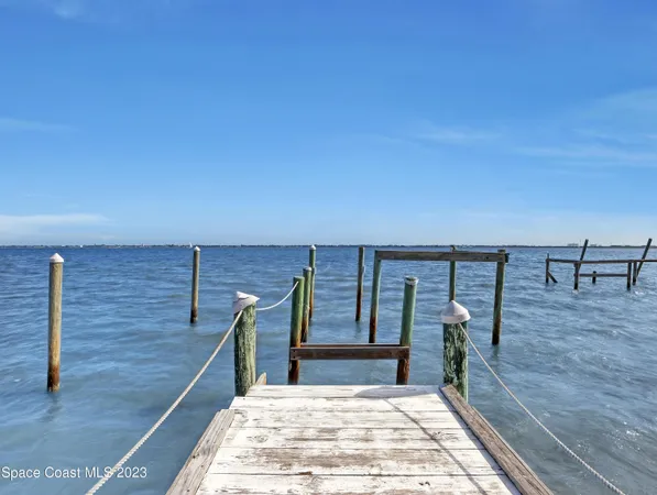 a view of balcony with wooden floor and seating space
